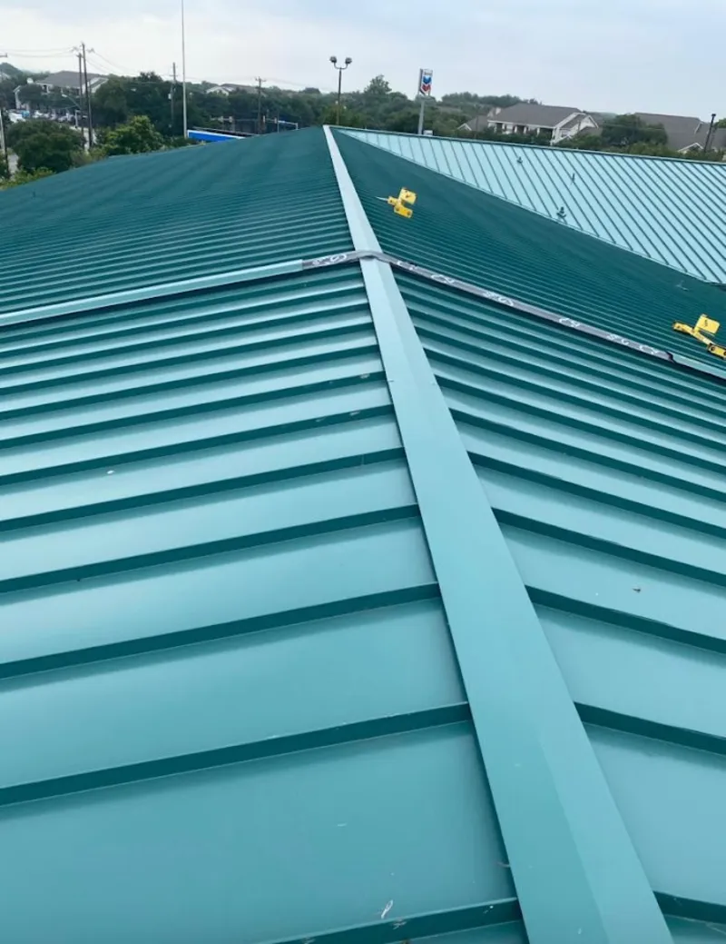 Green commercial metal roof ridge and valley for Metal Roof Repair in Mentor-on-the-Lake