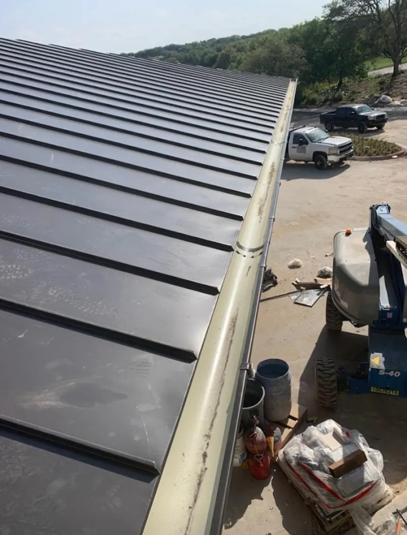 Standing seam panel and gutter detail on a metal roofing jobsite in Mentor-on-the-Lake